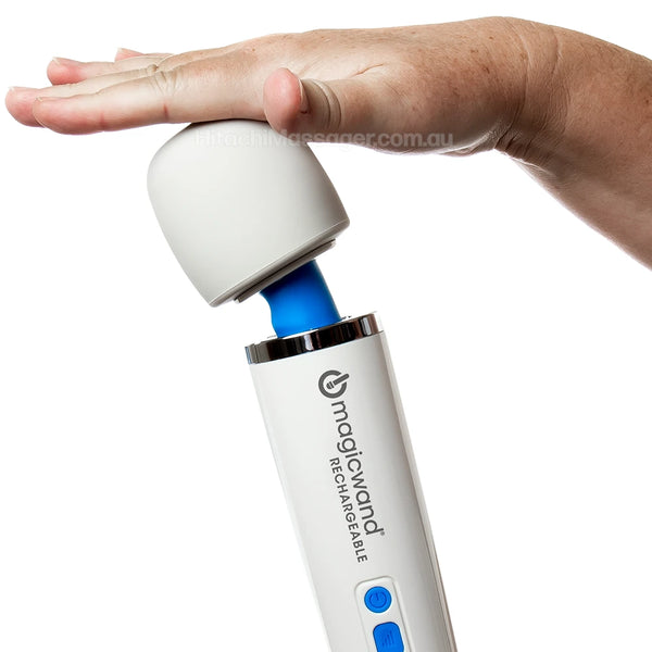 Hitachi Magic Wand Rechargeable closeup product picture on a white background of the silicone massage head being touched by a womans hand.